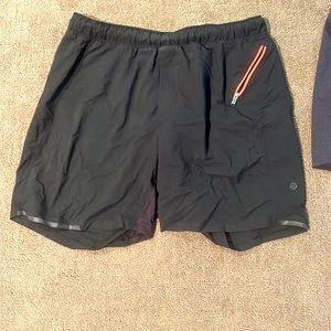 Black athletic shorts. Fits more like a large